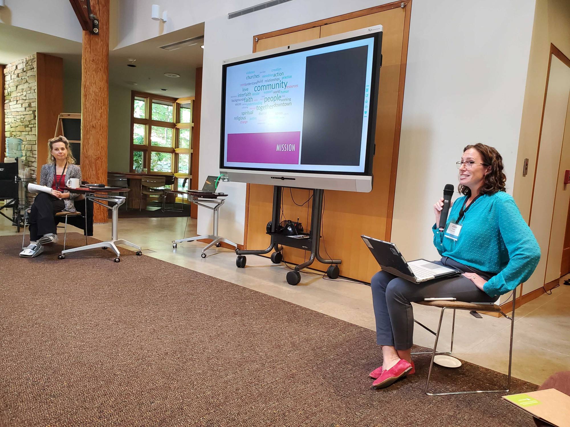 Two facilitators presenting a slide show